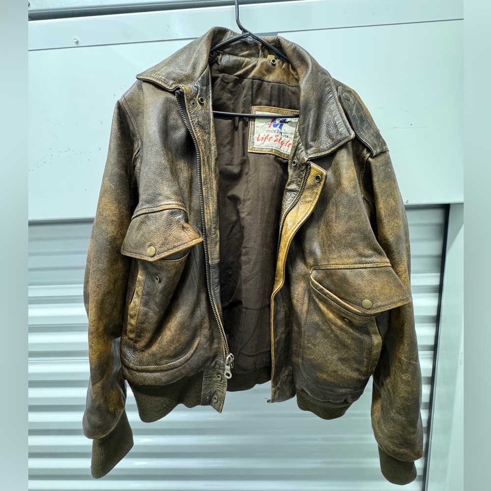 Vintage brown leather bomber jacket.